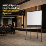 The Executive Meeting Paradox: Elite Conference Room Setup 2 KING Flipchart professional board positioned in a conference room with an audience. Text in the image: KING Flipchart: Engineered for Presentation Spaces. Next to the best.